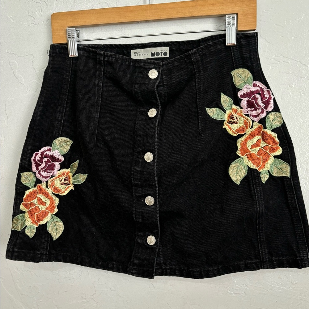 Black denim embroidered mini skirt.